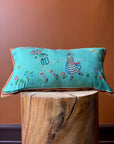 Blue pillow with embroidery
