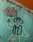 Blue pillow with embroidery